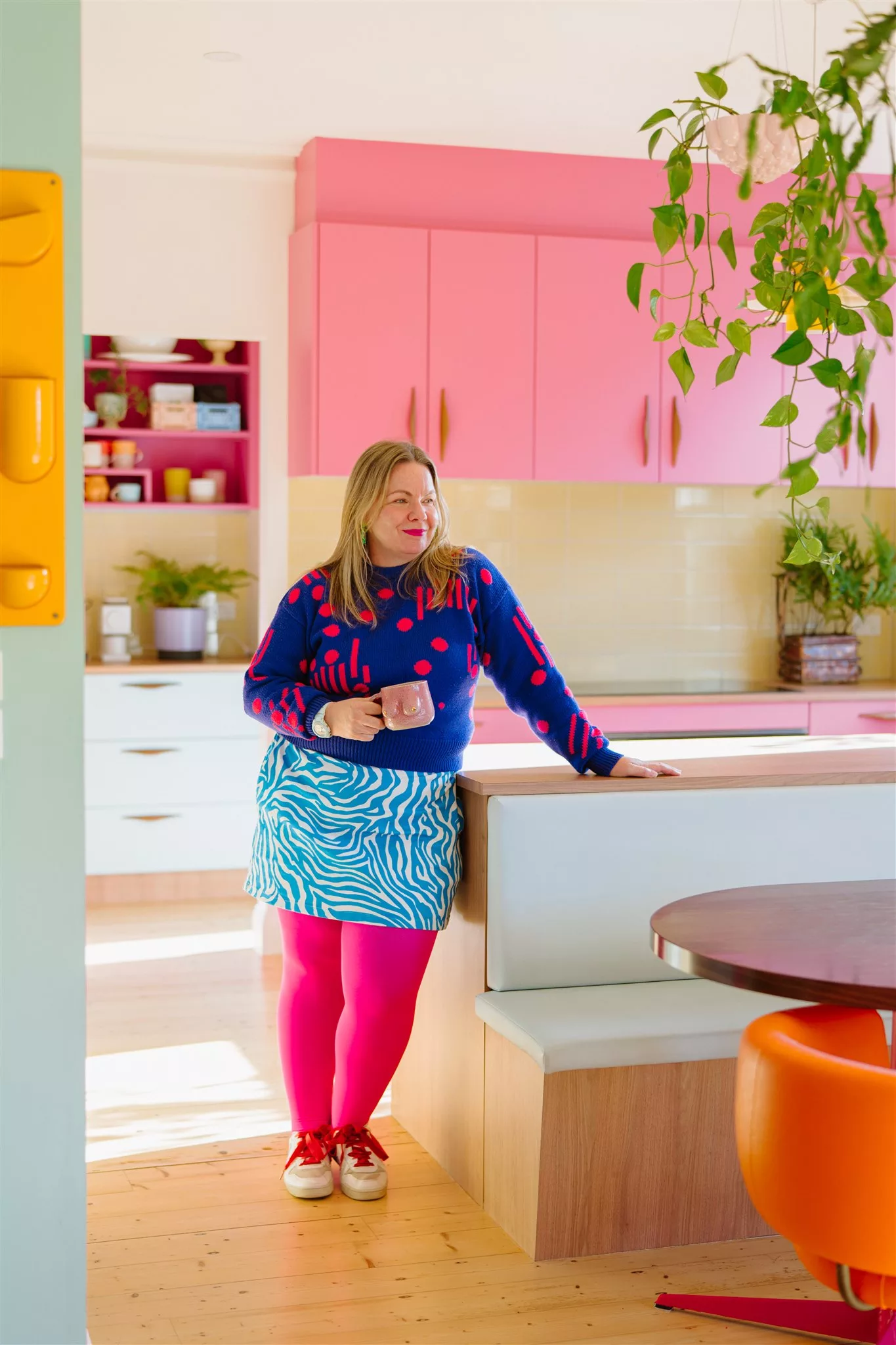 Kate from Good Day Club in the kitchen she designed